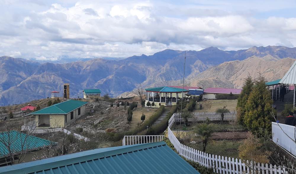 resort in matogi uttarakhand with mountains in the backdrop